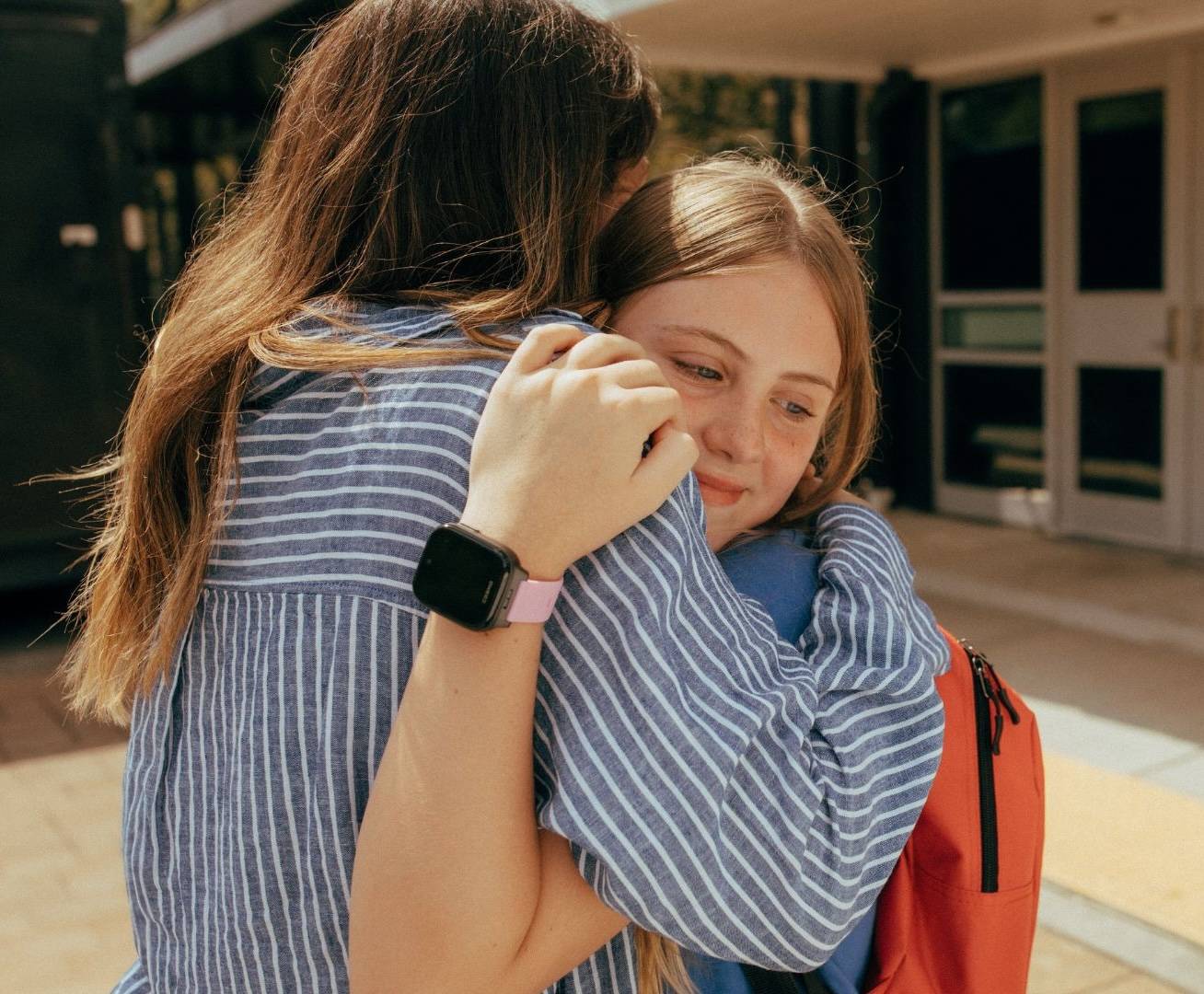 Child wearing Cosmo JrTrack watch during school activities